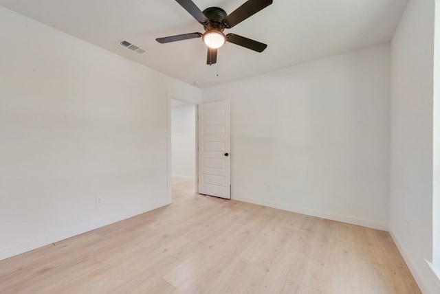 spare room featuring ceiling fan and light wood-type flooring