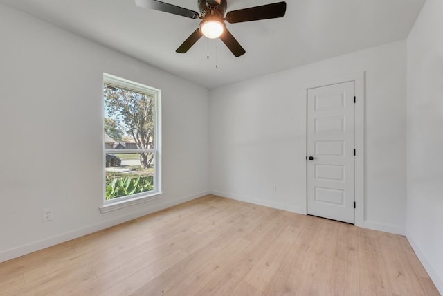 spare room with light hardwood / wood-style floors and ceiling fan