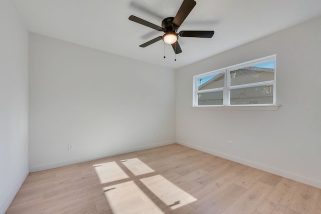 unfurnished room with ceiling fan and light hardwood / wood-style floors