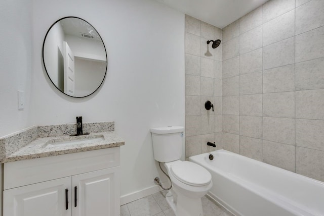 full bathroom featuring tile patterned floors, vanity, toilet, and tiled shower / bath