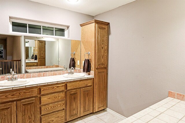 bathroom featuring tile patterned flooring and vanity