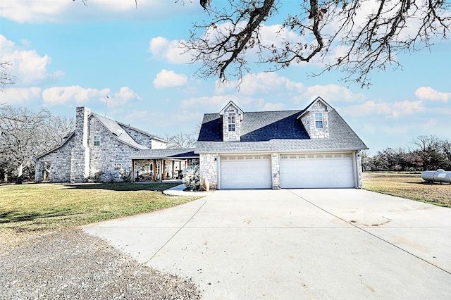 view of front of home with a front yard and a garage