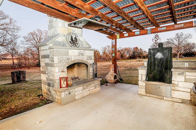 view of patio with an outdoor stone fireplace