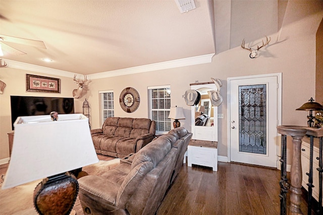 living room with ceiling fan, dark wood-type flooring, and ornamental molding