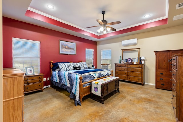 carpeted bedroom with multiple windows, a tray ceiling, and ceiling fan