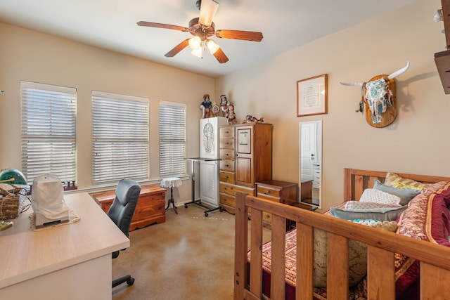 bedroom with ceiling fan and light colored carpet