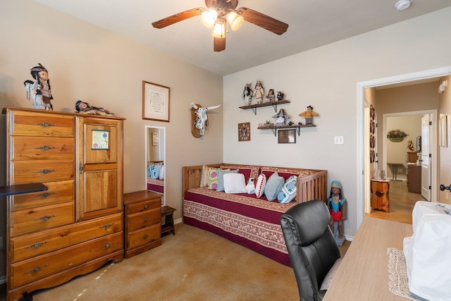 home office with ceiling fan and light colored carpet