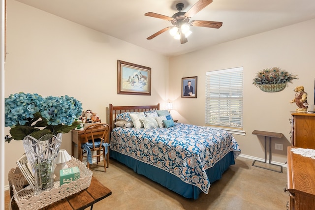 bedroom with light colored carpet and ceiling fan