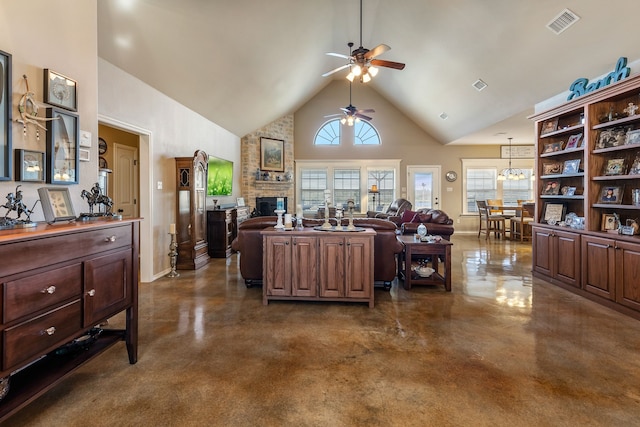 kitchen with dark brown cabinets, a large fireplace, high vaulted ceiling, and ceiling fan