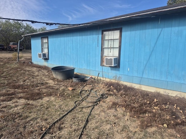 view of home's exterior with cooling unit