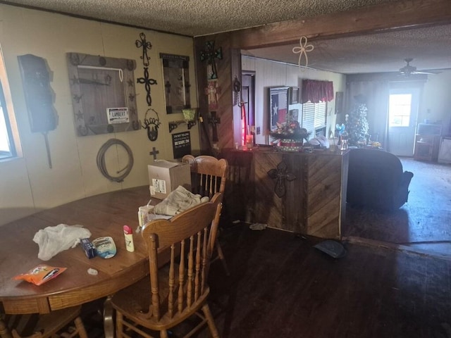 dining room featuring ceiling fan and a textured ceiling