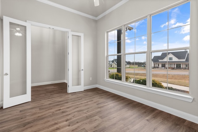 unfurnished bedroom with french doors, ceiling fan, ornamental molding, and hardwood / wood-style flooring