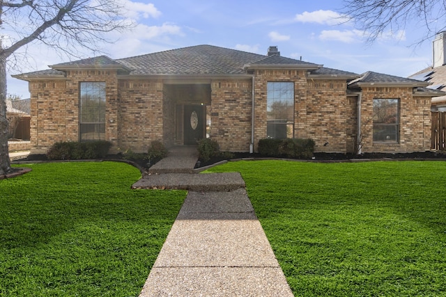 view of front of home with a front lawn