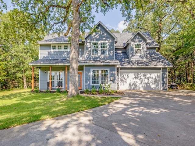 view of front of home with a front lawn and a garage