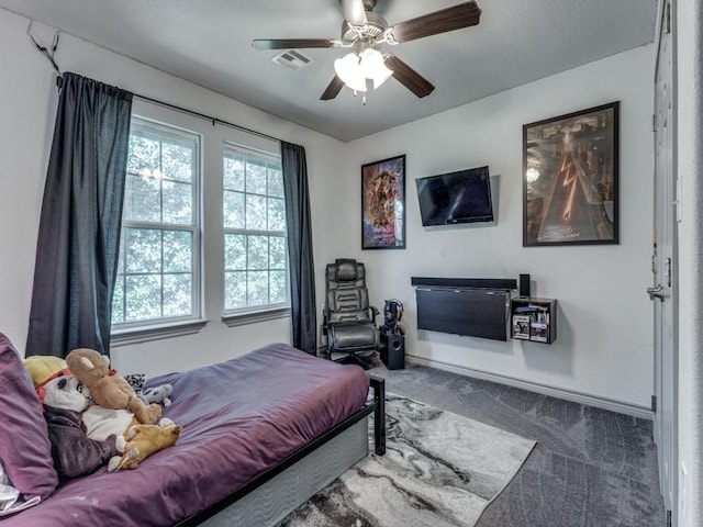 bedroom with ceiling fan and carpet floors