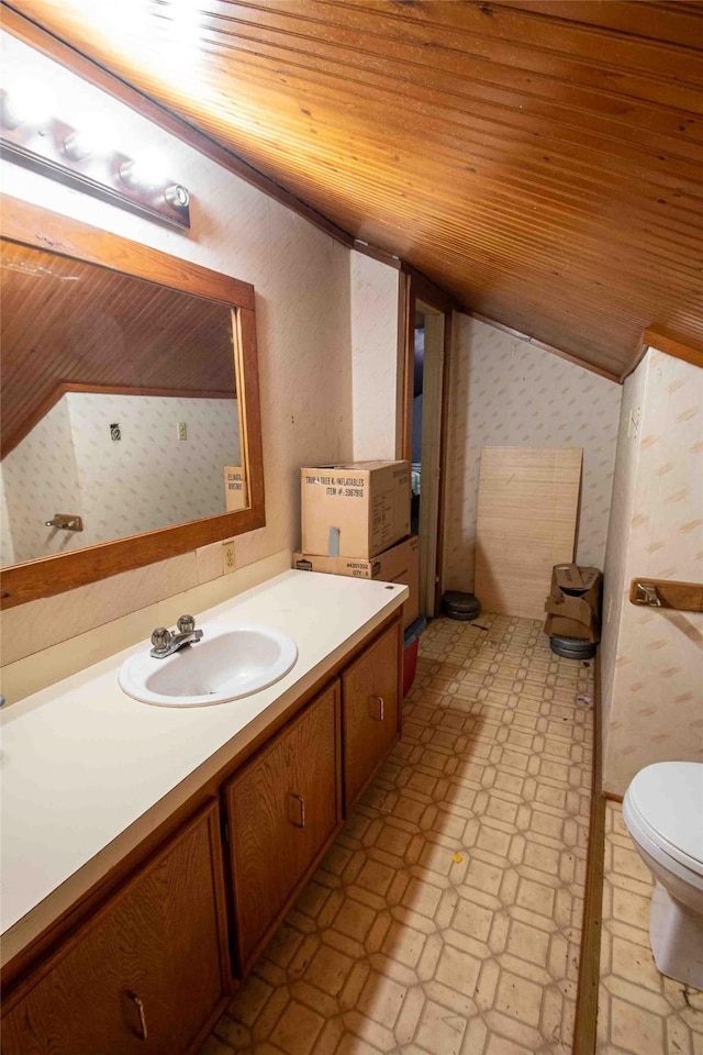 bathroom with vanity, wood ceiling, vaulted ceiling, and toilet