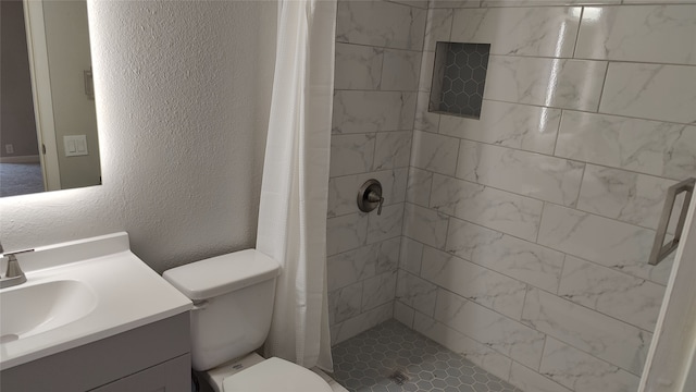 bathroom with a shower with curtain, vanity, and toilet