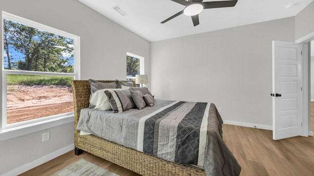 bedroom featuring ceiling fan and hardwood / wood-style flooring