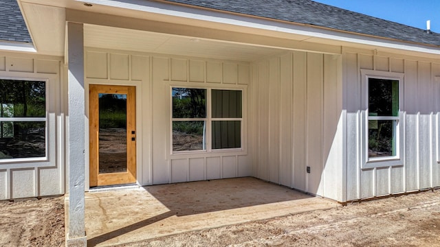 entrance to property featuring a patio