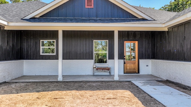 doorway to property with a porch