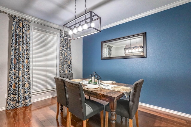 dining space with dark hardwood / wood-style floors and crown molding