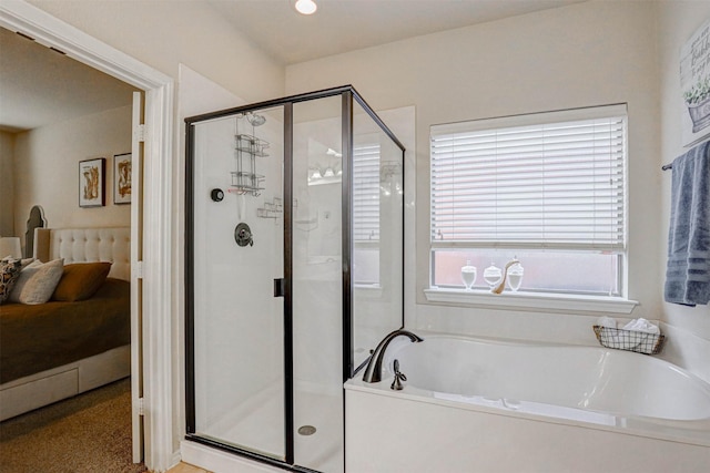 bathroom with shower with separate bathtub