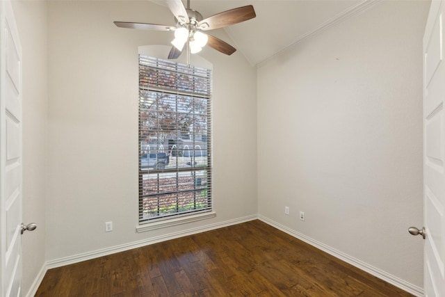 spare room with ceiling fan, lofted ceiling, ornamental molding, and dark hardwood / wood-style flooring