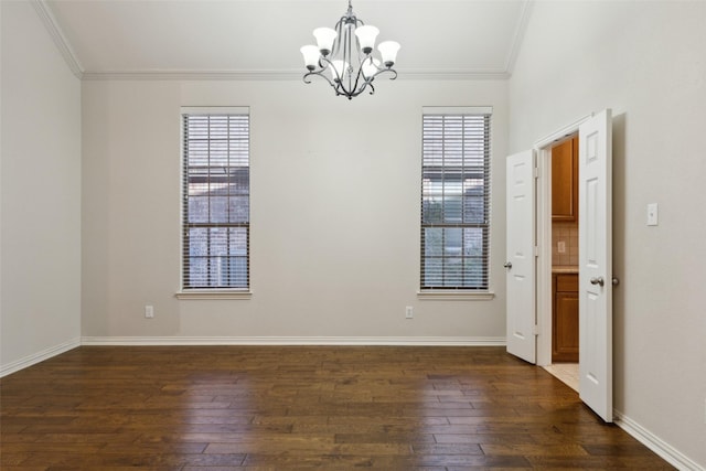 empty room with crown molding, dark hardwood / wood-style flooring, and a wealth of natural light