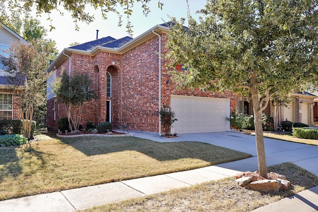 view of front of property with a front lawn and a garage