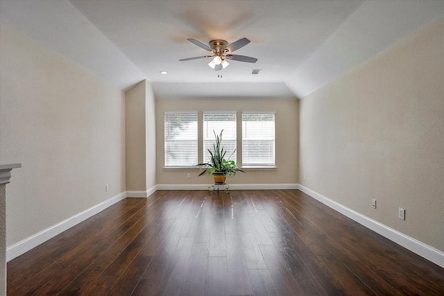 unfurnished living room featuring dark hardwood / wood-style floors, ceiling fan, and lofted ceiling