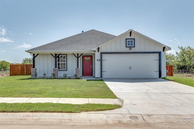 ranch-style home featuring a garage and a front lawn