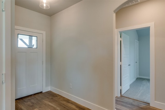 entryway with wood-type flooring