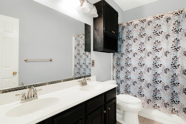 full bathroom with tile patterned floors, vanity, toilet, and shower / bath combo