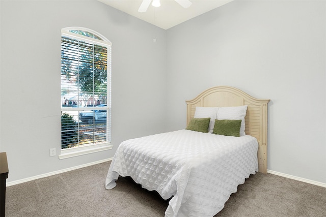 bedroom with ceiling fan and carpet floors