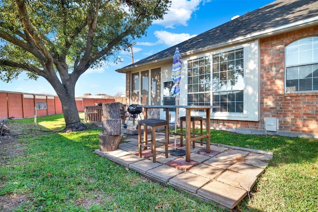 view of yard with a patio and a sunroom