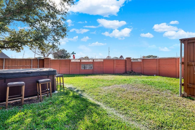 view of yard with a hot tub