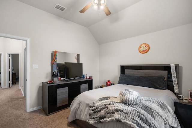 carpeted bedroom with vaulted ceiling and ceiling fan