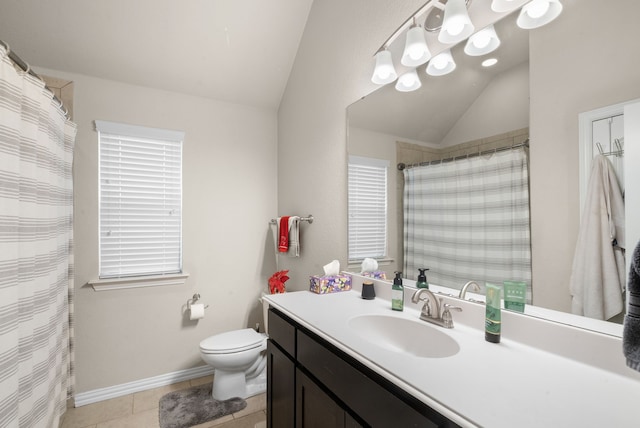 bathroom with tile patterned floors, vanity, vaulted ceiling, and toilet