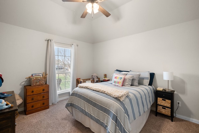 bedroom featuring lofted ceiling, ceiling fan, and carpet flooring