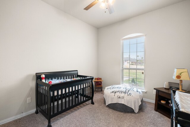 carpeted bedroom featuring ceiling fan