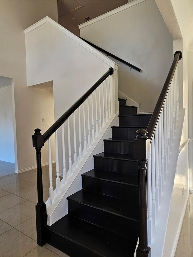 stairs featuring tile patterned flooring