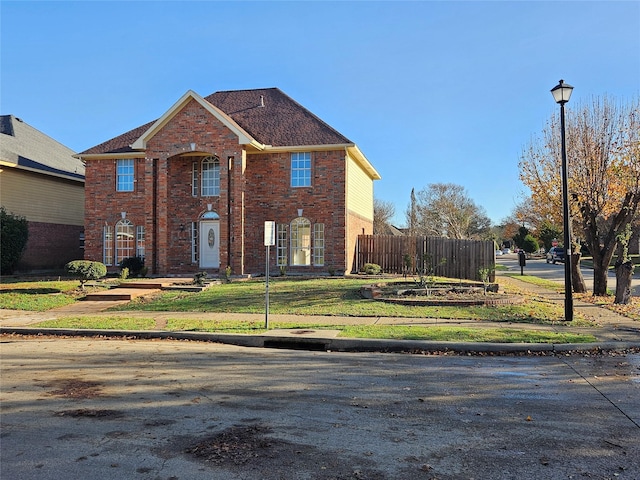 view of property with a front lawn