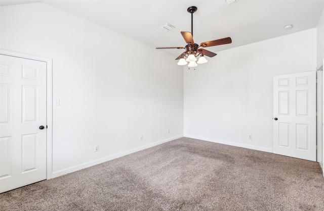 carpeted spare room with ceiling fan and lofted ceiling