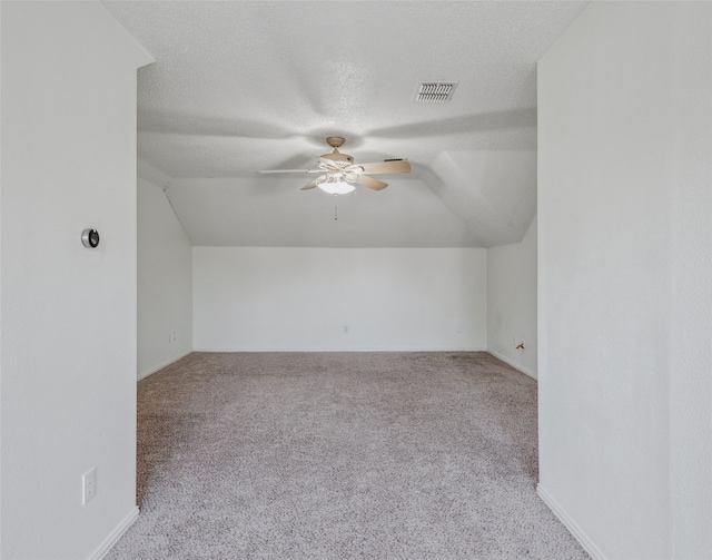 bonus room featuring ceiling fan, light colored carpet, and lofted ceiling