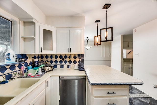 kitchen with dishwasher, sink, hanging light fixtures, decorative backsplash, and white cabinets