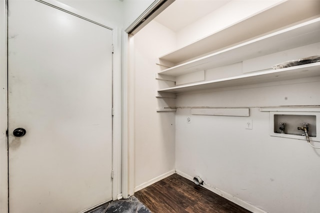 laundry room featuring washer hookup and dark hardwood / wood-style flooring