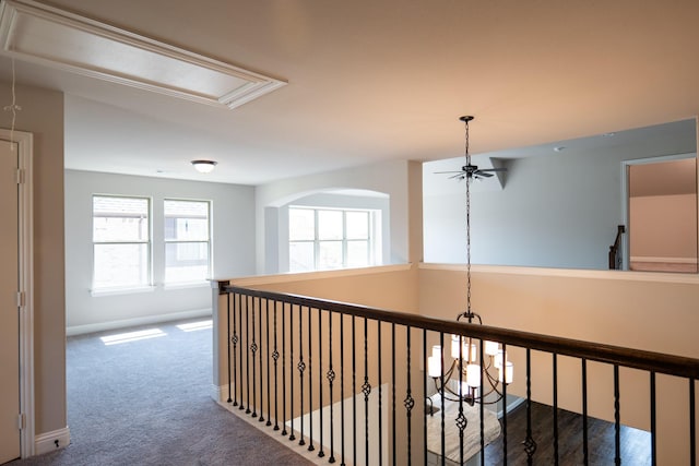 hallway featuring dark colored carpet