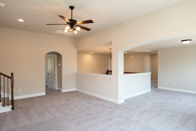 carpeted empty room featuring ceiling fan