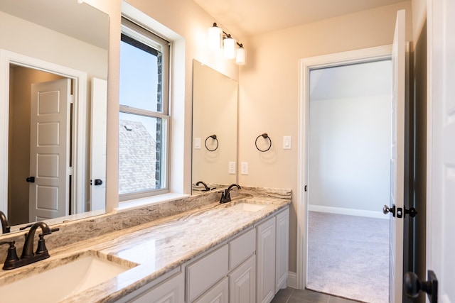 bathroom featuring tile patterned flooring and vanity