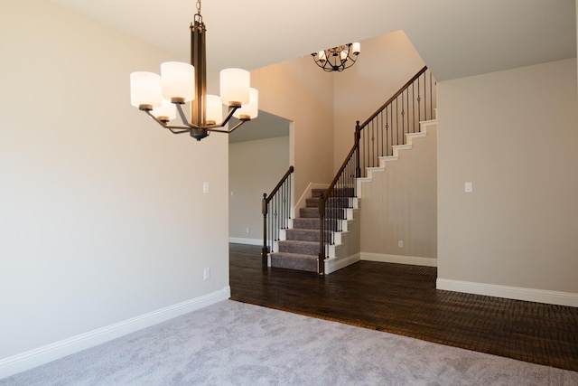 interior space with wood-type flooring and an inviting chandelier